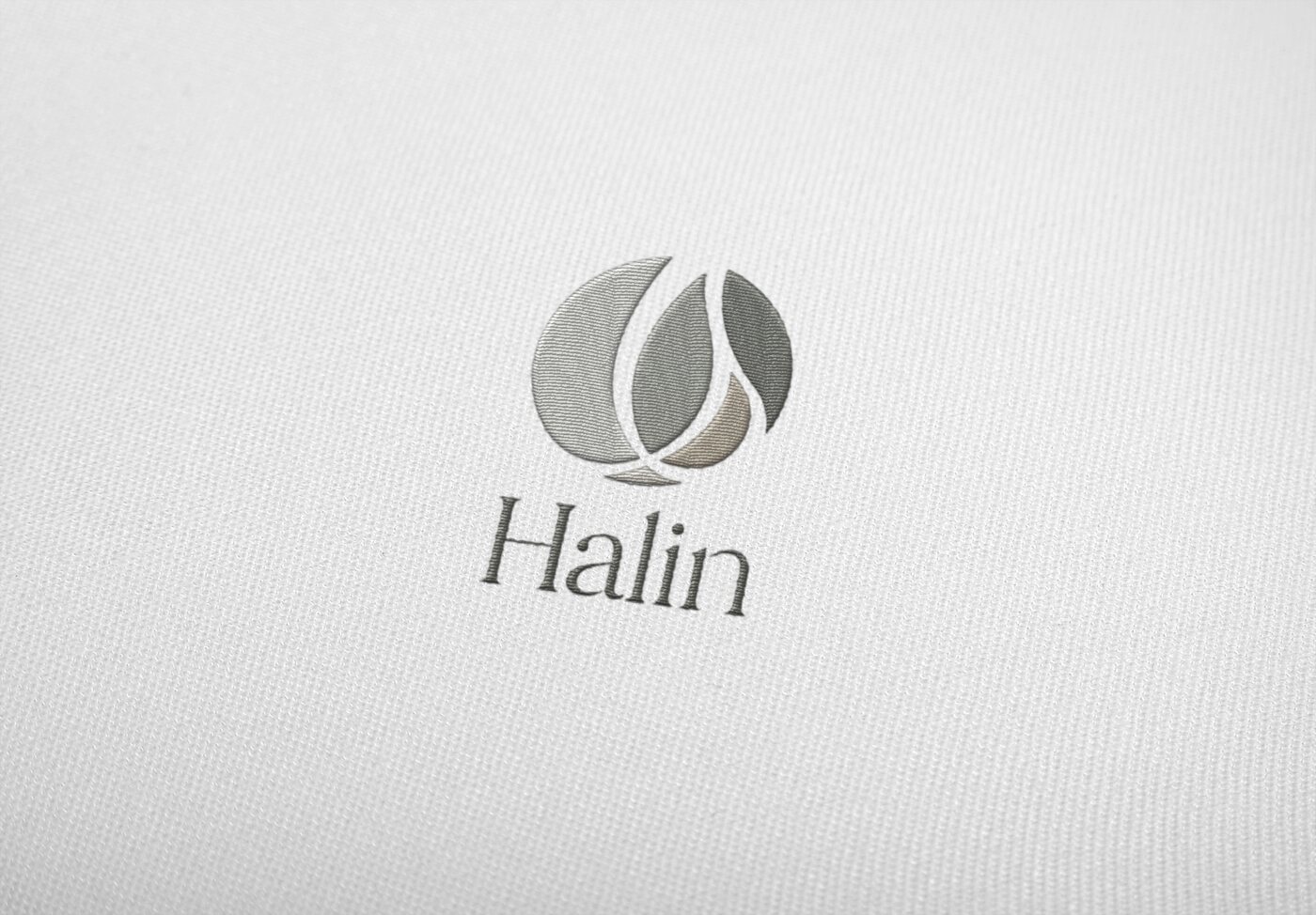 Halin logo embroidered on white fabric
